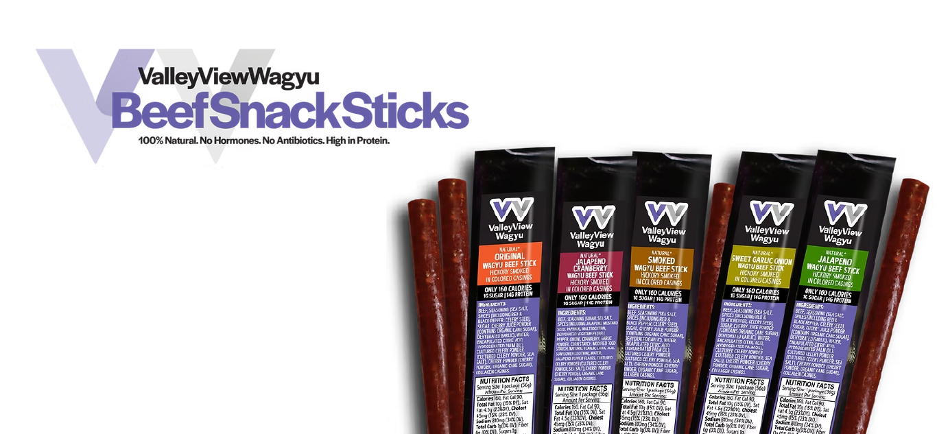 Six ValleyView Wagyu Beef Snack Sticks in various flavors, shown with their black and purple packaging tubes and two loose sticks on a white background with the brand logo and text on the left.