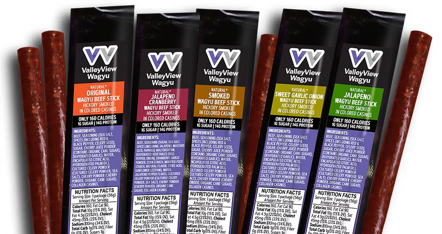 Four ValleyView Wagyu beef sticks with their corresponding retail packaging tubes displayed side-by-side on a clean white background.